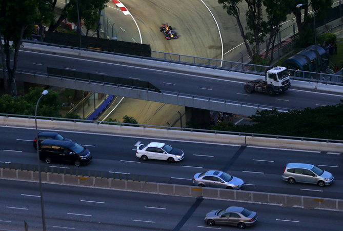 The Singapore Grand Prix runs while traffic continues to flow on the highways above the track The Singapore Grand Prix runs while traffic continues to flow on the highways above the track