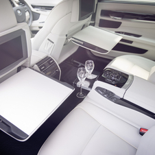The interior mixes piano black lacquer and ostrich leather 