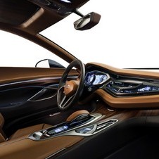 The interior mixes high end materials including rosewood and titanium