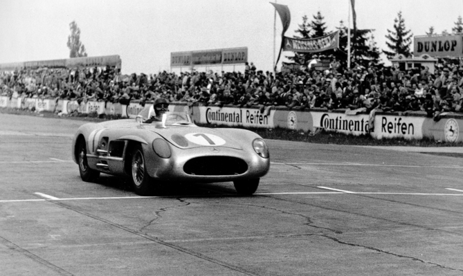 Racing in 1955: Juan Manuel Fangio wins the 18th international ADAC Eifel race on the Nürburgring with his Mercedes-Benz 300 SLR (W 196 S). Racing in 1955: Juan Manuel Fangio wins the 18th international ADAC Eifel race on the Nürburgring with his Mercedes-Benz 300 SLR (W 196 S).