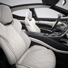 It features a quilted leather interior with contrasting color trim and metal trim