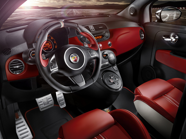 The interior is covered in red leather with white accents and red stitching The interior is covered in red leather with white accents and red stitching