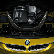 The CFRP strut brace is the first thing you see under the hood