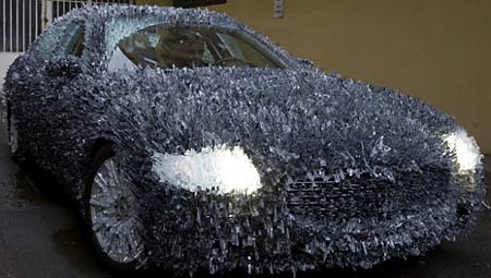 Maserati covered with 1,763 lbs of shattered glass Maserati covered with 1,763 lbs of shattered glass