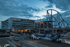 The roller coaster and new hotel are the reason that the track is in such financial trouble