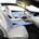 The interior is classy and all white with leather and blue accents