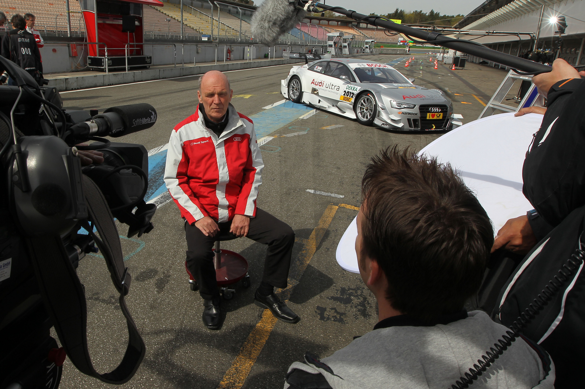 Dr. Ullrich taking interviews in front of the new A5 DTM