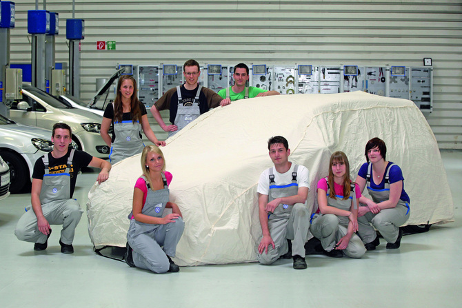 The team posing with their car that will be unveiled in May The team posing with their car that will be unveiled in May