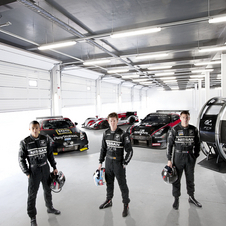 The previous winners posing with the GT Academy vehicles and simulator