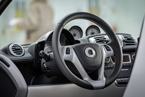 The interior is upgraded with fake leather seats with cloth inserts