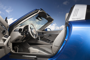 The roof is stowed behind the rear seats when open