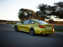 The M4 gets a molded rear spoiler into the trunk