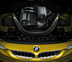 The CFRP strut brace is the first thing you see under the hood