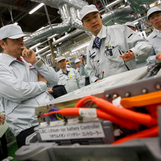 Nissan CEO Carlos Ghosn (Left) touring a Nissan factory