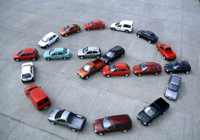 The Corsa B line-up parked in shape of the Opel logo. The Corsa B line-up parked in shape of the Opel logo.